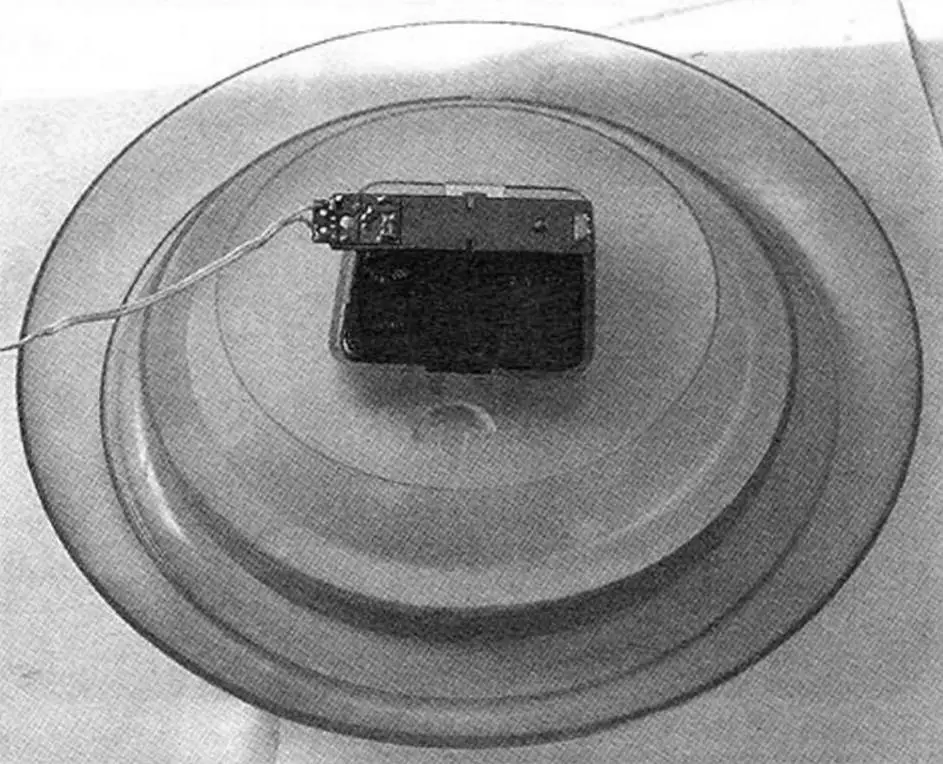 Wall clock powered by the aforementioned power source