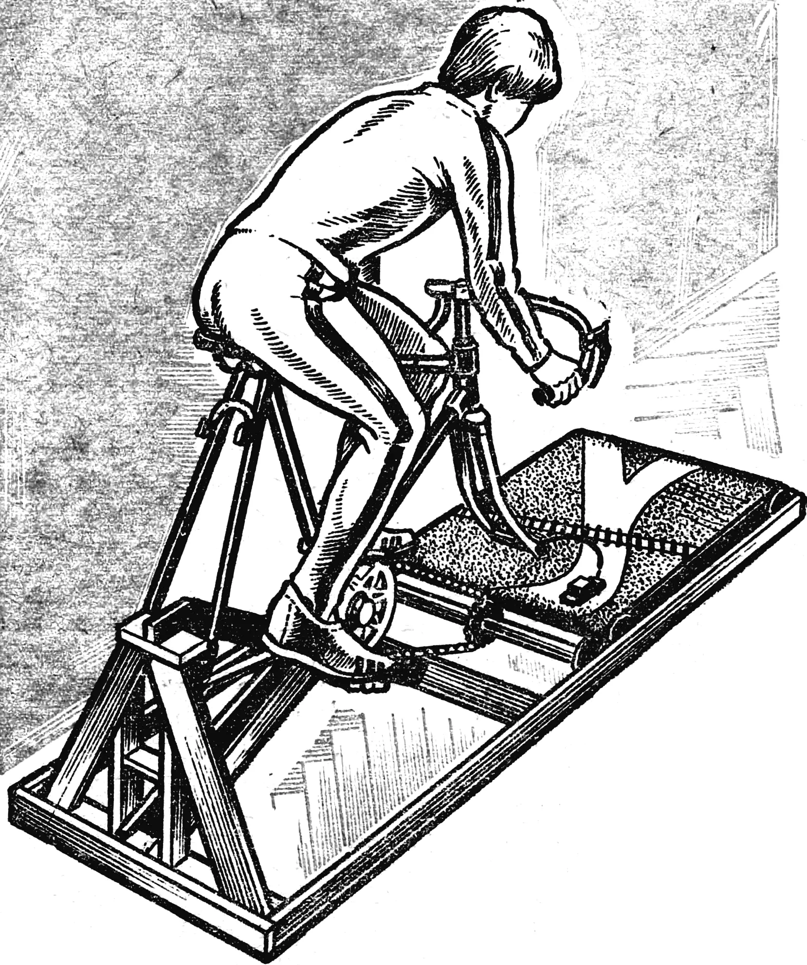 Indoor bike trainer with an endless road belt