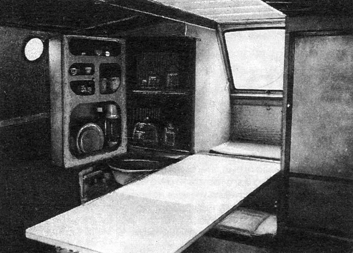 Mini-galley in the Triton cabin: folding table and sink